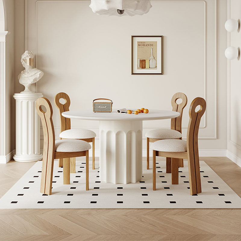 Heman Round Dining Table lifestyle view with travertine dining table