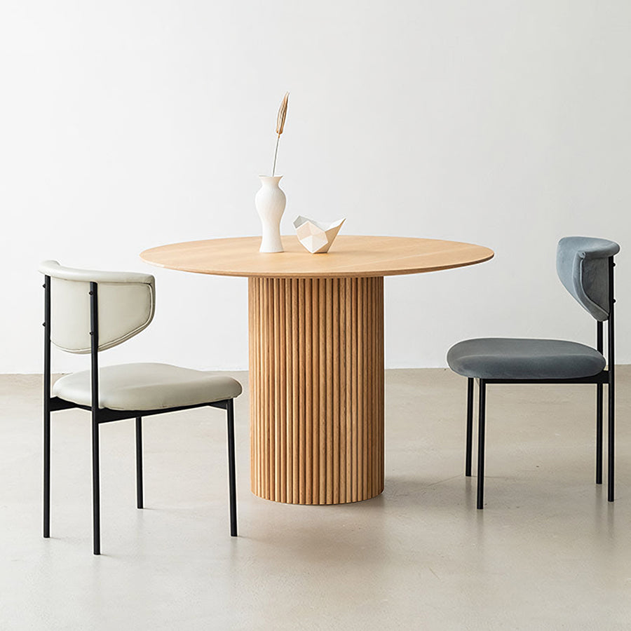 Ivar Round Dining Table lifestyle view with round black wood dining table