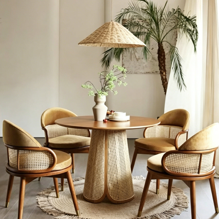 Skylar Rattan Dining Table lifestyle view with small wooden dining table
