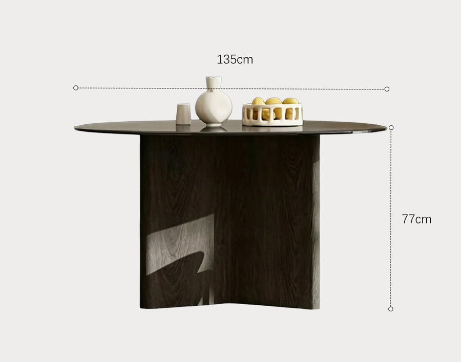 Tricia Dining Table lifestyle view with black glass round dining table