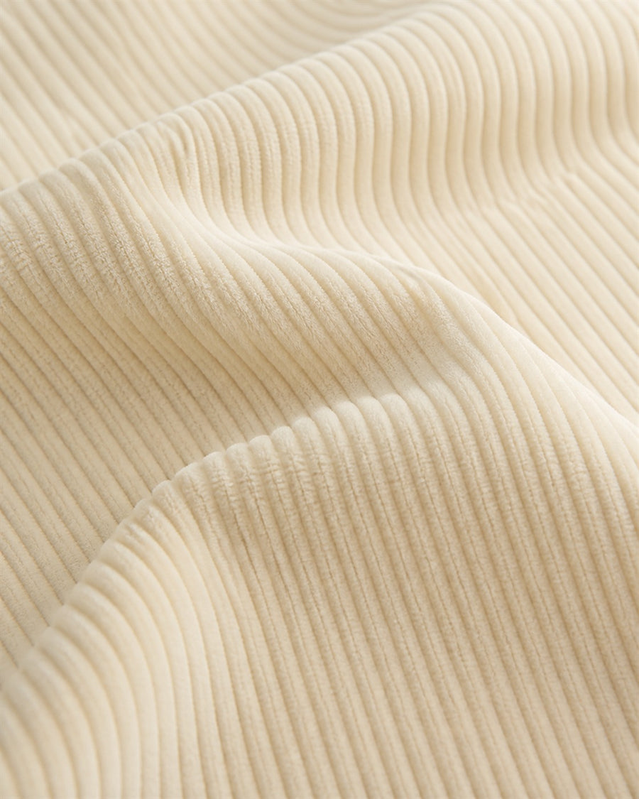 Off white corduroy material close-up