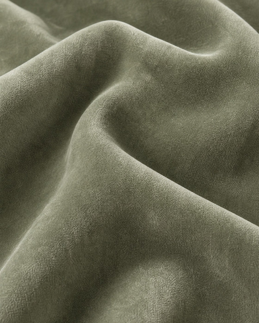 Sage green velvet material close-up